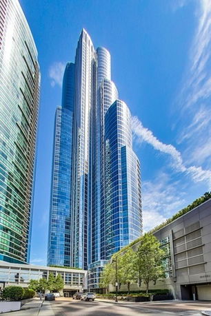 Front view of a modern skyscraper with glass facade.