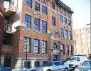 Front view of a multi-story brick building.
