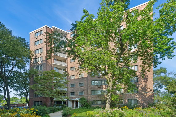 Front view of a multi-story brick building.