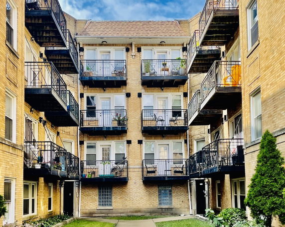 Front view of an apartment building with balconies.