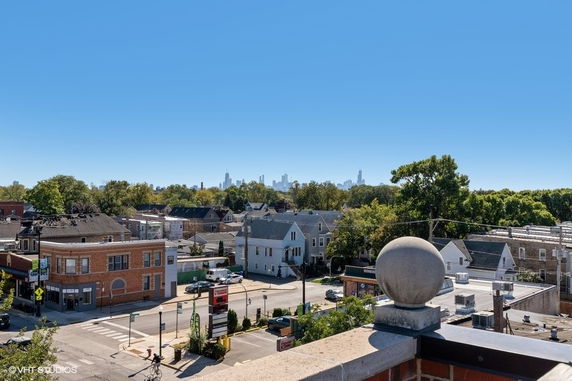 Panoramic view of a neighborhood with distant skyline.
