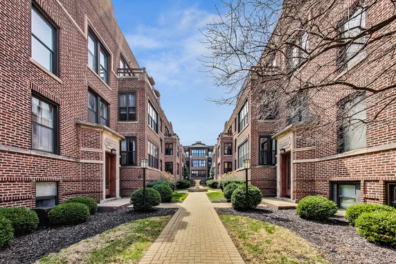 Front view of a multi-story brick residential building.