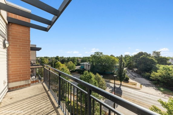 View of surrounding areas with trees and streets from the building