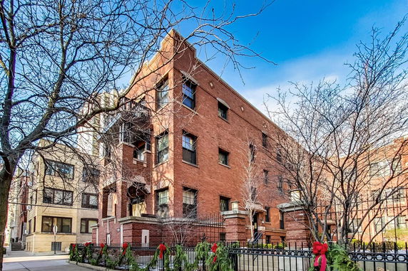 Front view of a multi-story brick building.