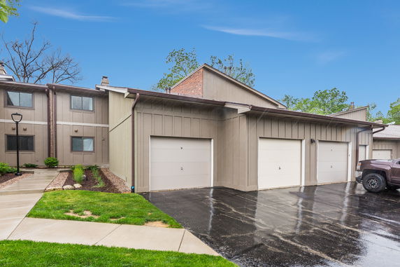 Front view of a building with garages.