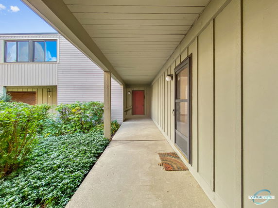 Front view of a single-story house with a covered walkway.