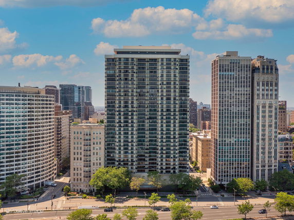 Front view of multiple high-rise buildings in an urban cityscape.