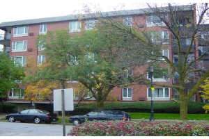 Front view of a multi-story brick apartment building