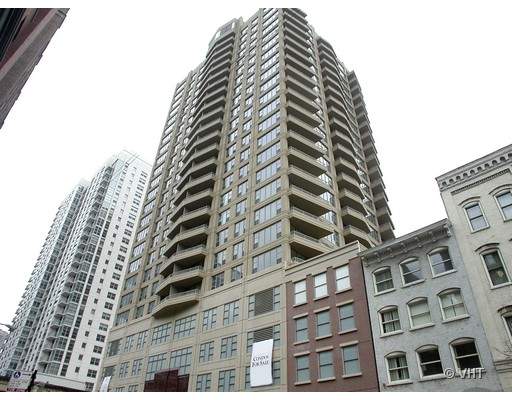 Front view of a tall multi-story residential building.