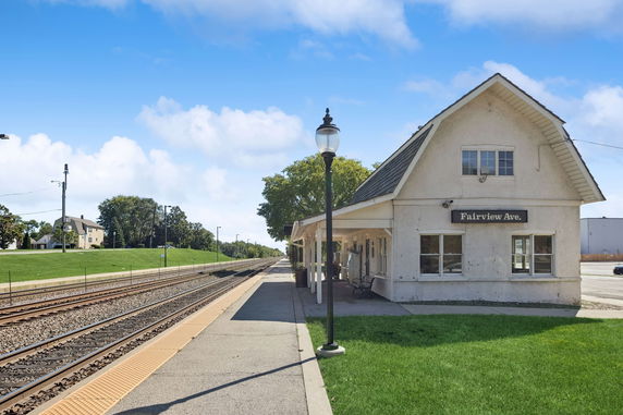 Front view of a small train station building labeled 'Fairview Ave.'