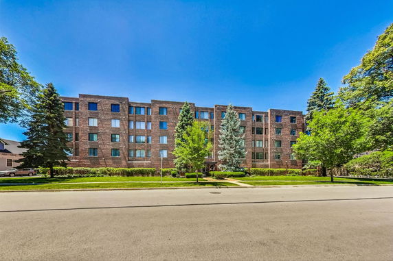 Front view of a multi-story brick apartment building