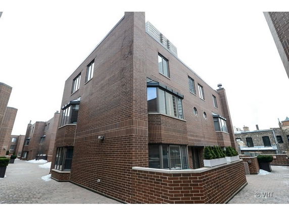 Front view of a multi-story brick building with modern design.