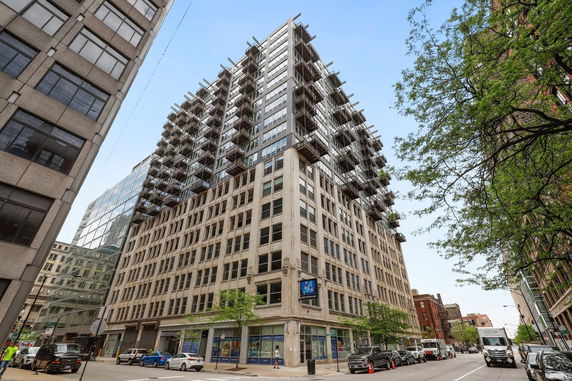 Front view of a multi-story building with balconies.