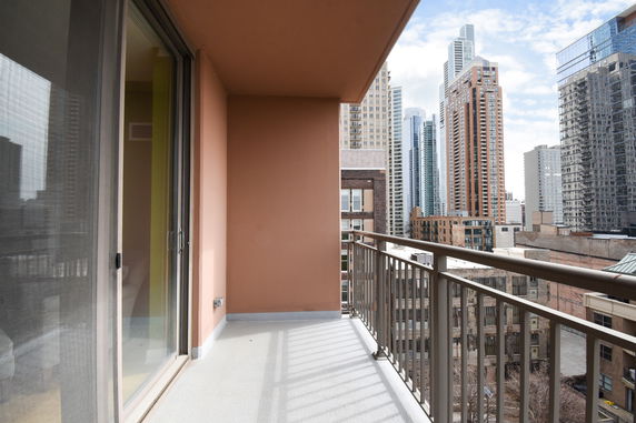 View from a balcony showing high-rise buildings in the background.