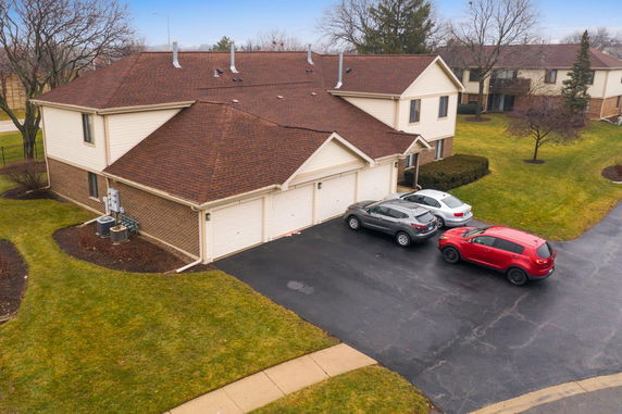 Front view of a two-story house with an attached garage.