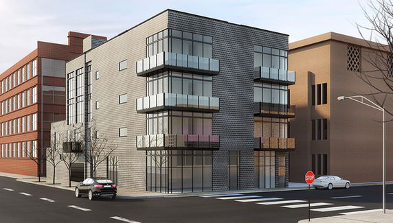 Front view of a modern multi-story building with large windows and balconies.