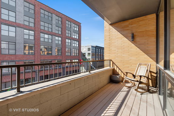 Balcony with a view of neighboring buildings.