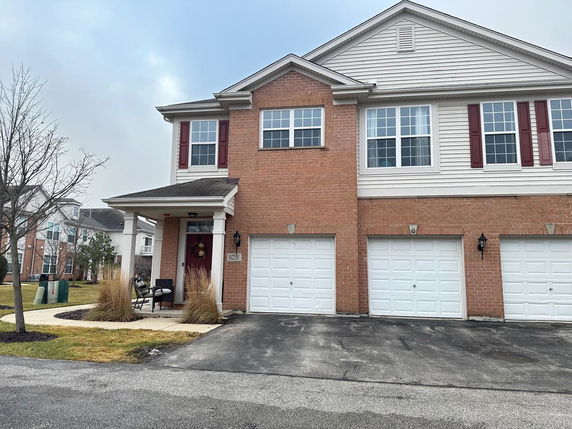 Front view of a two-story house with a double garage.
