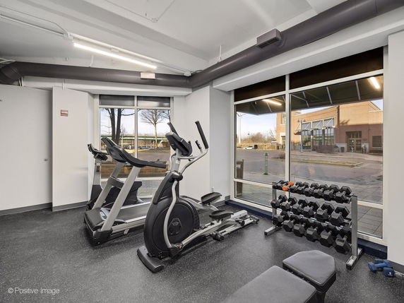 Gym area with exercise equipment and weights