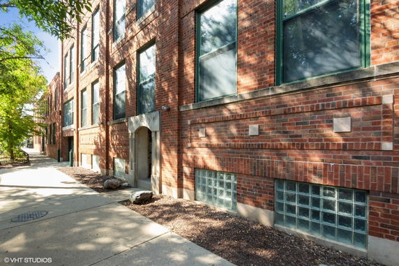 Front view of a brick apartment building.