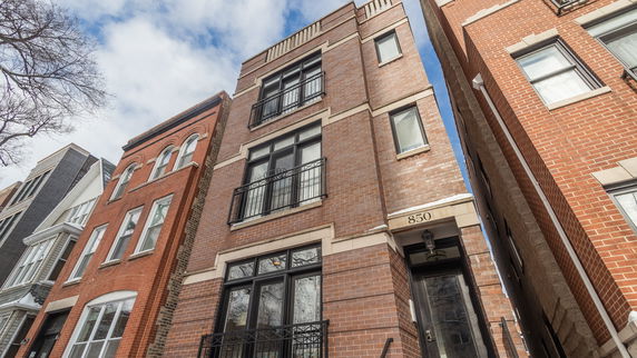 Front view of a multi-story brick building.