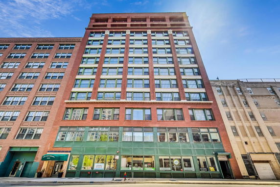 Front view of a multi-story brick building.