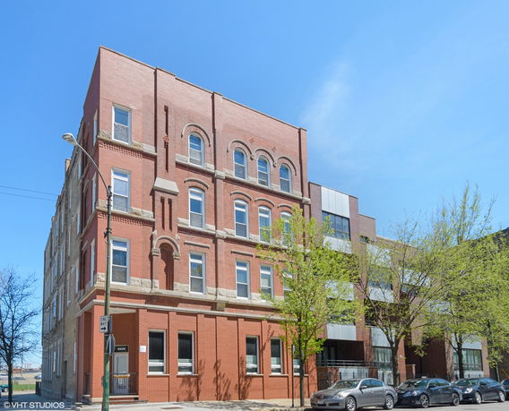 Front view of a multi-story brick building.