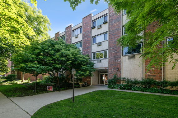 Front view of a multi-story brick building.