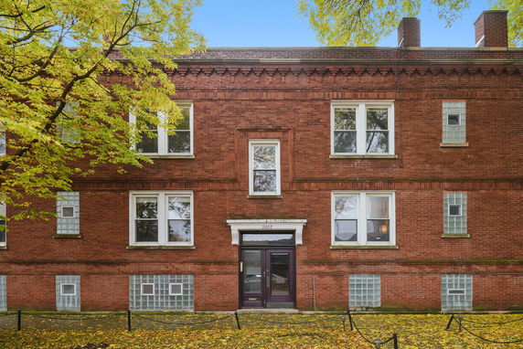 Front view of a brick apartment building.