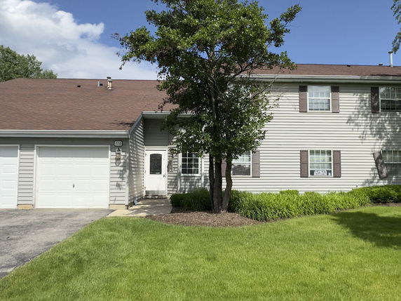 Front view of a two-story house with a double garage.