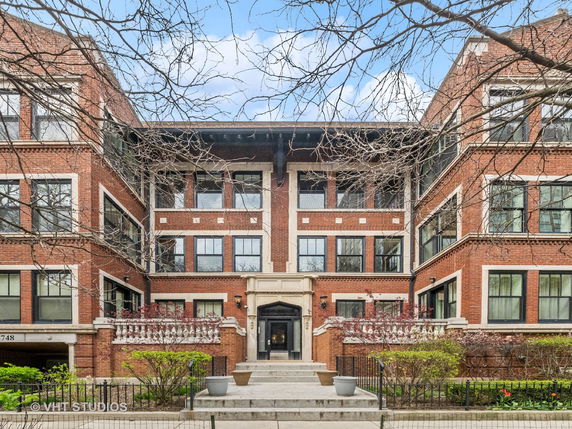 Front view of a multi-story brick apartment building