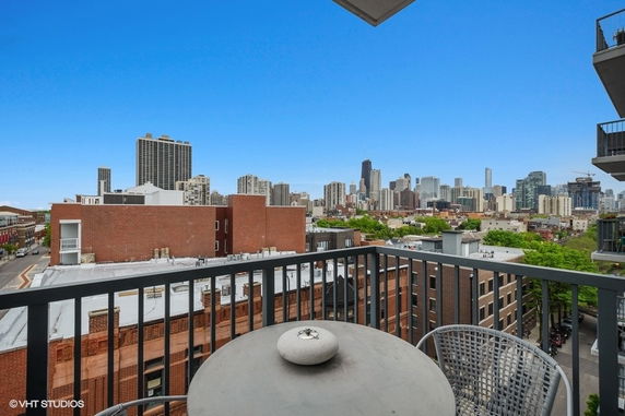 View of city skyline from a balcony.
