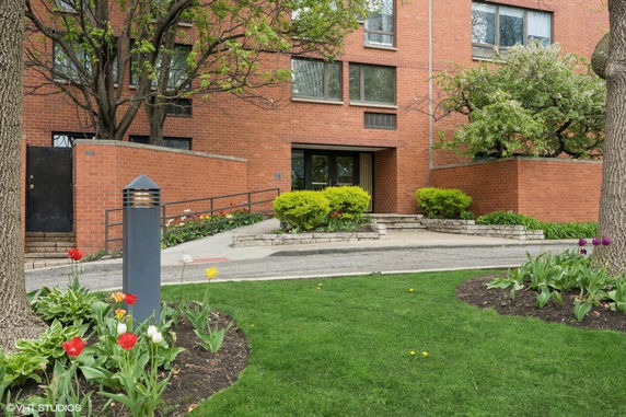 Front view of a multi-story brick building.