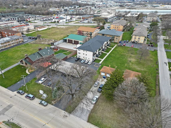 Aerial view of a residential neighborhood with multiple apartment buildings and houses.