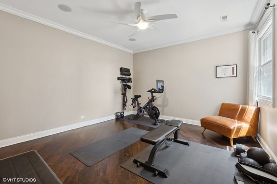 Home gym with fitness equipment including a stationary bike and workout bench.
