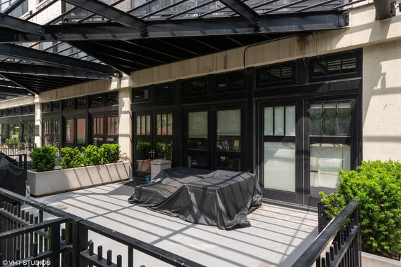 Front view of a building with covered outdoor area.