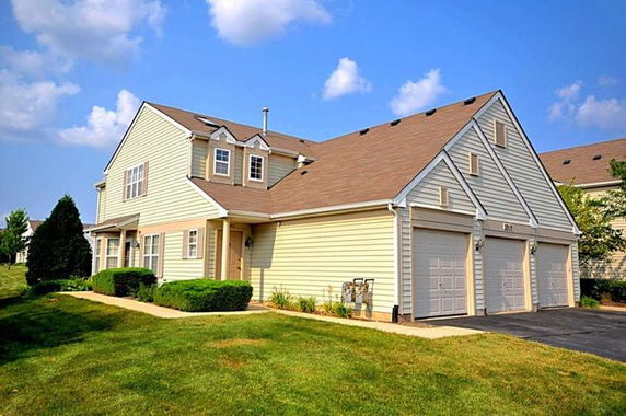 Front view of a two-story house with a double garage.