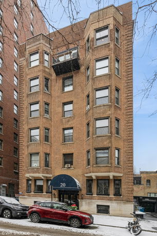 Front view of a multi-story brick building.
