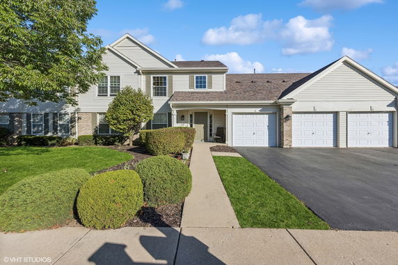 Front view of a two-story house with a double garage.