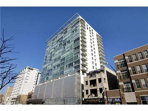 Front view of a modern multi-story building with a glass facade.