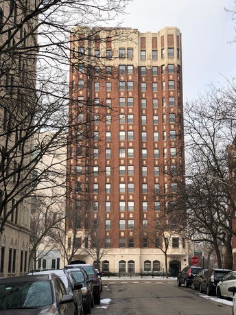 Front view of a multi-story brick building.