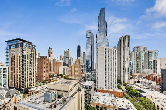 Panoramic view of a city skyline with multiple high-rise buildings.