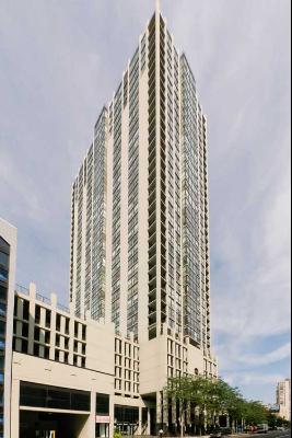 Front view of a tall modern high-rise building with numerous windows.