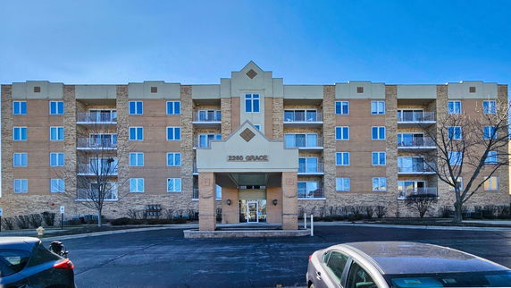 Front view of a multi-story building with balconies.