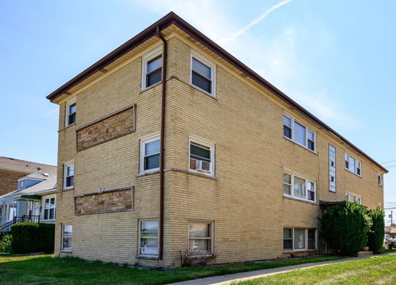 Front view of a three-story brick building.