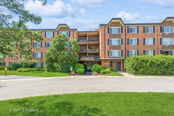 Front view of a multi-story brick apartment building
