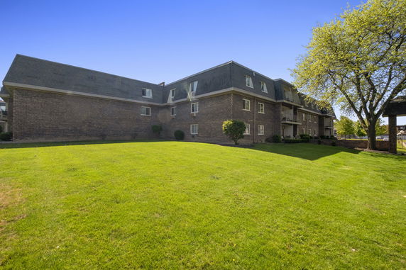 Front view of a multi-story brick building.