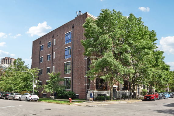 Front view of a multi-story brick building.