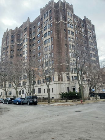 Front view of a multi-story brick building.