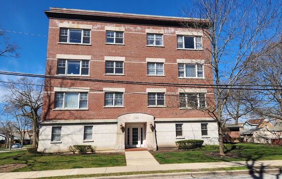 Front view of a four-story brick building